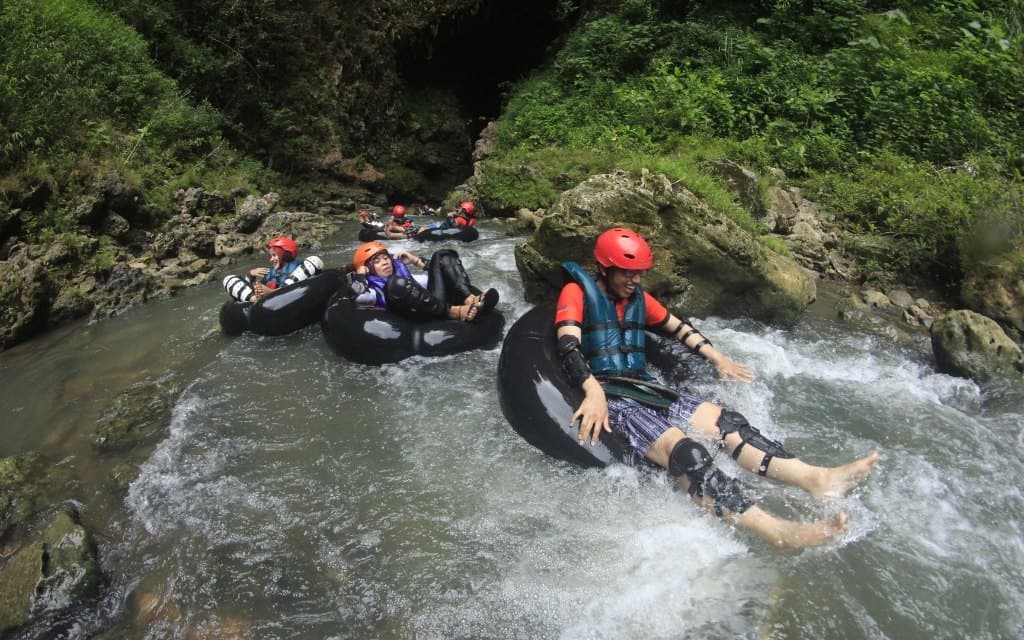 Guests floating down the river on tubes, the water half of the ATV and tubing day